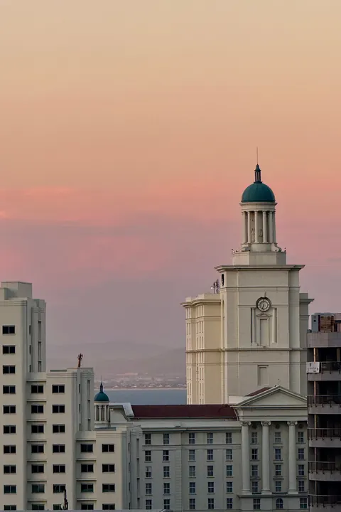 Cape Town's skyline at sunset, older facades in front of the towers behind them